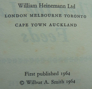 When the Lion Feeds By Wilbur A. Smith. TRUE FIRST EDITION. SCARCE FIRST EDITION OF HIS FIRST NOVEL.