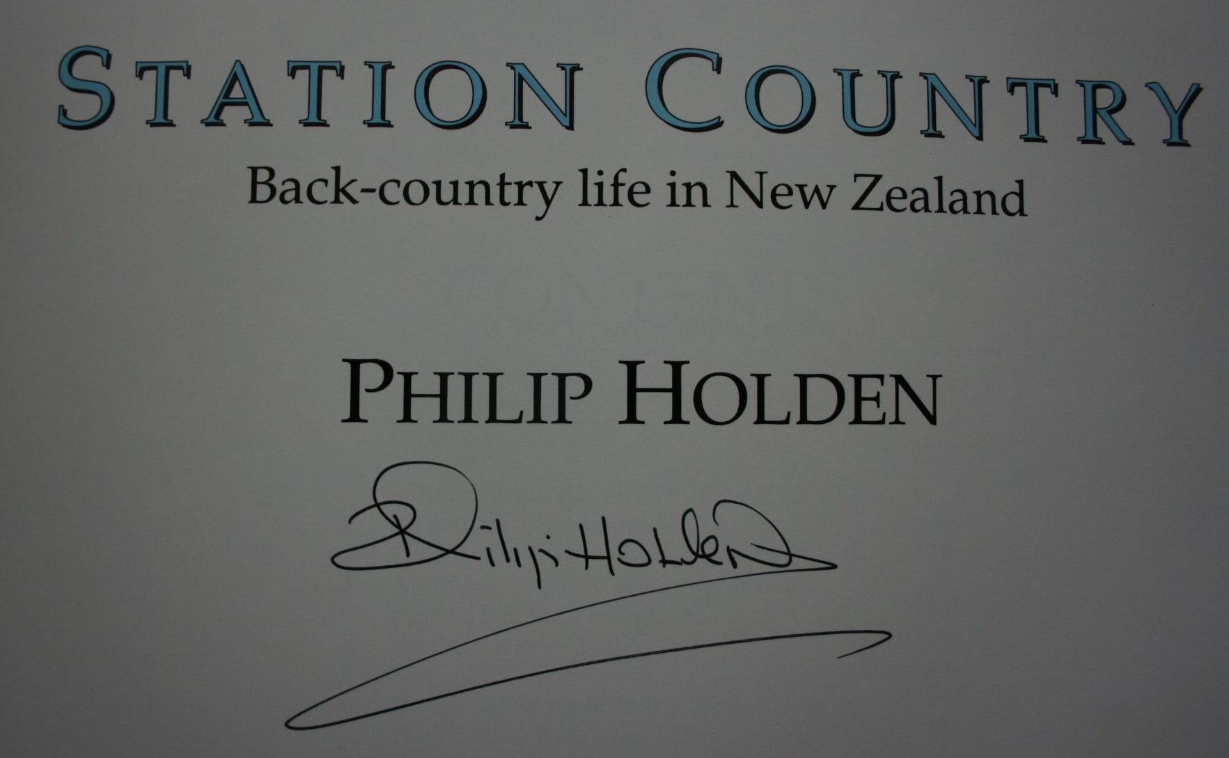 Station country: Back-country life in New Zealand BY Philip Holden. 1994. SIGNED BY AUTHOR.