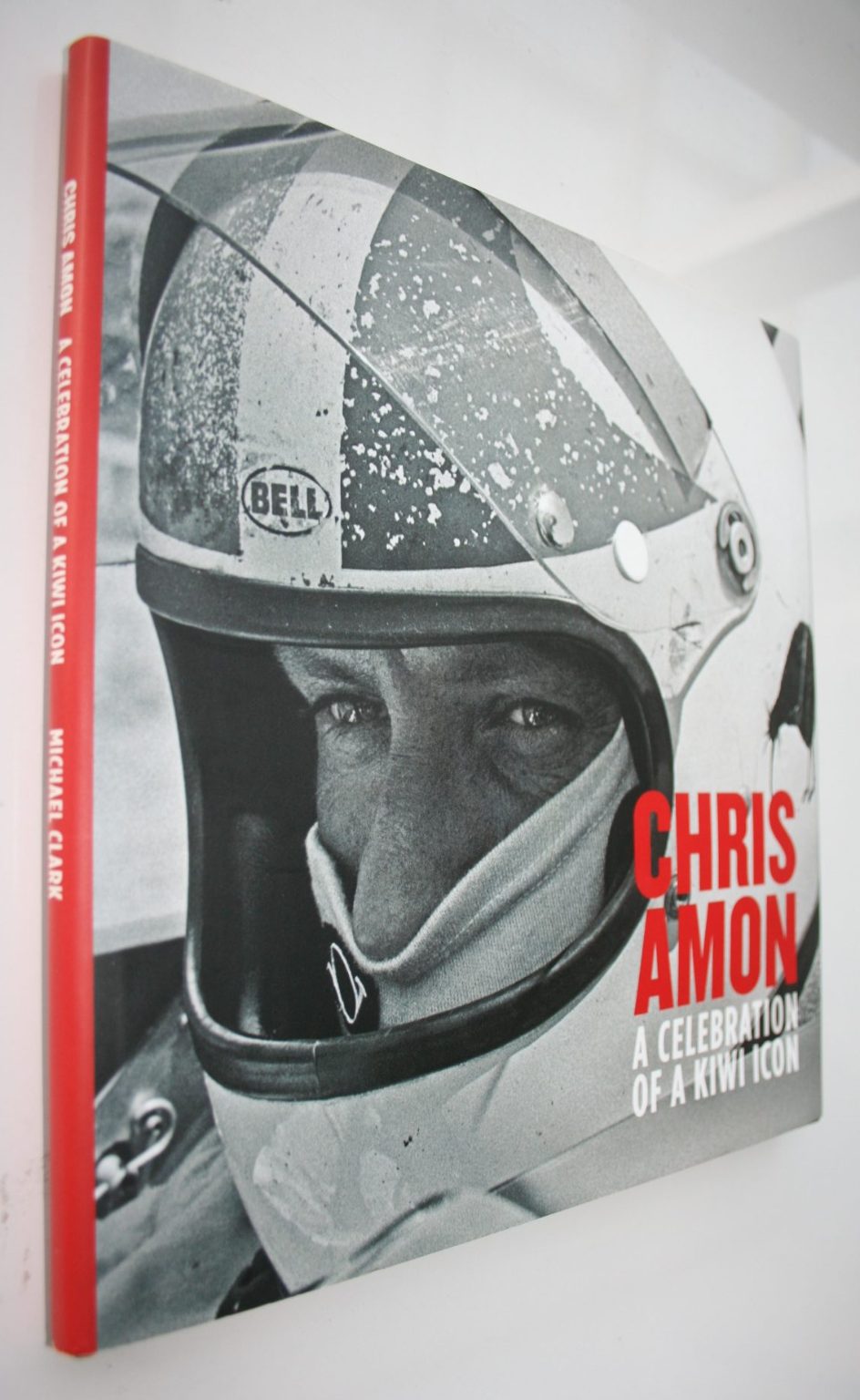 Chris Amon - A Celebration of a Kiwi Icon. Has 9 signatures on the front end paper: SIGNED BY Chris Amon